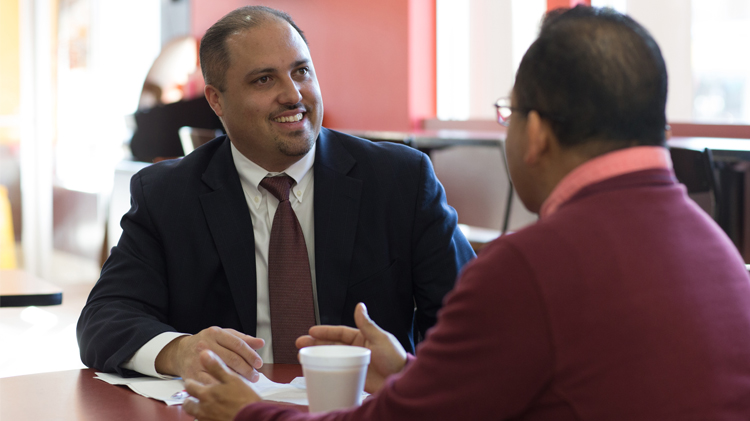 Male business owner meeting with a future employee.