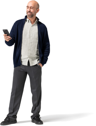 A man in a black jacket checks his smartphone.