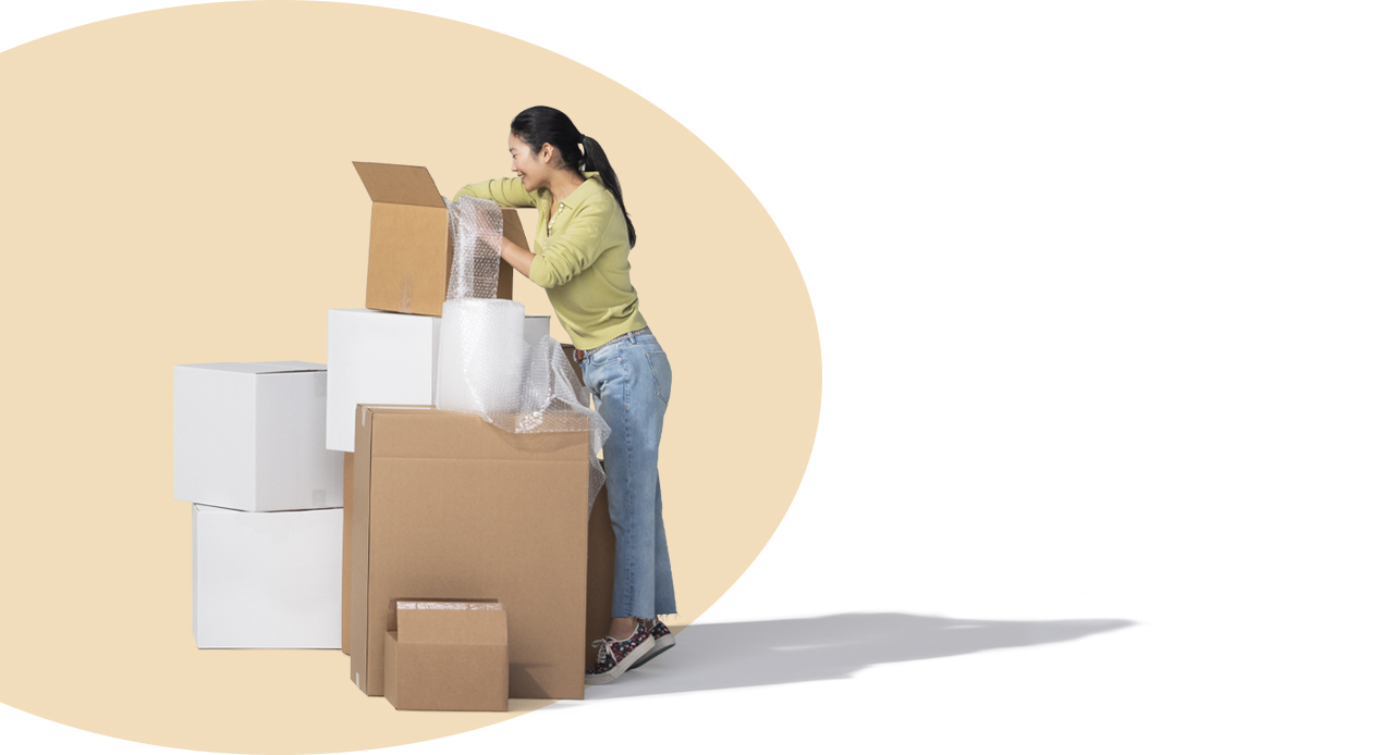 A woman unpacking moving boxes.